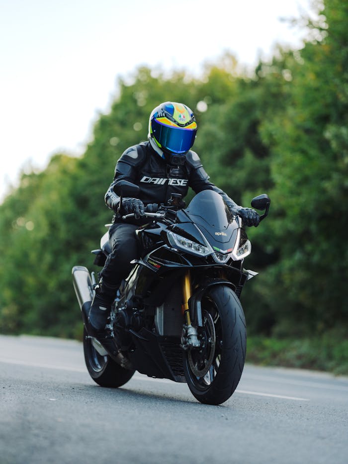 Motorcyclist on a Sportbike Riding Through Nature